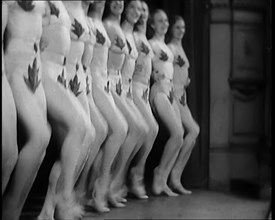 A Troupe of Dancers Wearing Fig Leaf Costumes Synchronised Dancing in Front of an Audience..., 1931. Creator: British Pathe Ltd.