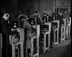 Male Civilians Building Radio Wireless Sets in a Factory, 1931. Creator: British Pathe Ltd.