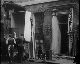 Two Male Civilians Load Furniture Into a Van Outside of 10 Downing Street, 1924. Creator: British Pathe Ltd.