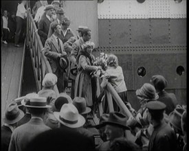 Mary Pickford and Douglas Fairbanks Senior Walking Down the Gangplank to Disembark from an..., 1920. Creator: British Pathe Ltd.