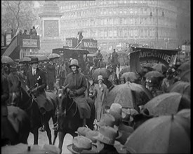 Female Civilians on Horseback Demonstrating in London Against Continuous Strikes in the Rain, 1926. Creator: British Pathe Ltd.