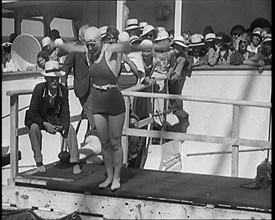 Female Civilian Diving Into the Shipboard Swimming Pool With a Crowd of Other Civilians..., 1931. Creator: British Pathe Ltd.