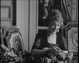 Mary Pickford Talking and Sitting Amongst Flowers in Paris, 1920. Creator: British Pathe Ltd.