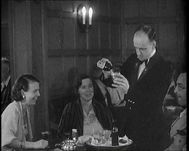 People Enjoying Drinks on a Cruise Liner Whilst at Sea, 1931. Creator: British Pathe Ltd.