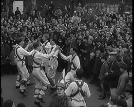 A Crowd of People Watching Morris Dancers Perform, 1931. Creator: British Pathe Ltd.