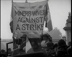 Women Gathering Around a Banner Reading 'Miners Wives Against a Strike', 1920. Creator: British Pathe Ltd.