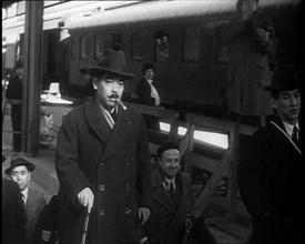 Japanese League of Nations Delegates Entering a Train Station, 1933. Creator: British Pathe Ltd.