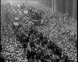 A Large Crowd Watching a Ticker Tape Parade in New York City, 1926. Creator: British Pathe Ltd.