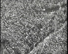 Crowds Watching the Coronation Procession of George VI, His Majesty the King, 1937. Creator: British Pathe Ltd.