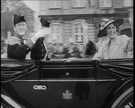 Well Dressed Men and Women Riding in a Car, 1930s. Creator: British Pathe Ltd.