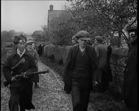 Male Civilian Being Arrested and Escorted Along a Country Lane by a Police Officer, 1920s. Creator: British Pathe Ltd.