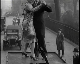 A Couple Dancing the Charleston on the Top of a Car Driving Down a London Street, 1926. Creator: British Pathe Ltd.