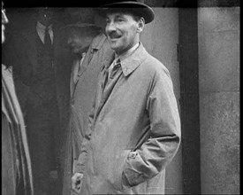 Clement at tlee Standing Outside a Building, 1930s. Creator: British Pathe Ltd.