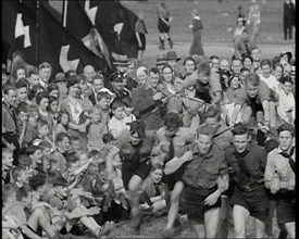 Hitler Youth Boys Engaging in Sporting Activities at  a Camp, 1930s. Creator: British Pathe Ltd.