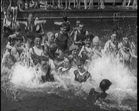 British People Splashing and Playing in the Chiswick Open Air Baths, 1920. Creator: British Pathe Ltd.