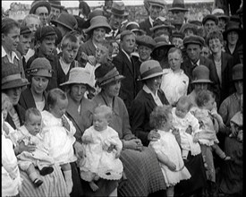 British Mothers Sitting With Their Babies on Their Laps at a Baby Show, 1920. Creator: British Pathe Ltd.