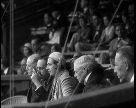 Former King Alphonso of Spain and His Wife, Victoria Eugenie of Battenberg Watching Tennis, 1930s. Creator: British Pathe Ltd.