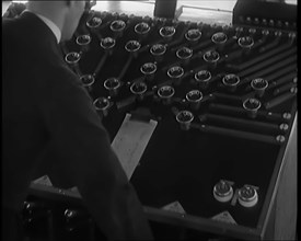 A Male Civilian Using System of Levers and Cogs To Make the Automated Railway Marshalling..., 1931. Creator: British Pathe Ltd.