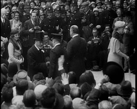 King George V and Other Well Dressed Men and Women Walking Through a Crowd with Photographers...1933 Creator: British Pathe Ltd.