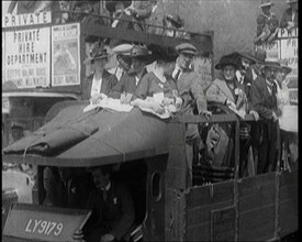 Cars, Buses and Pedestrians Arriving for the 1920 Epsom Derby, 1920. Creator: British Pathe Ltd.