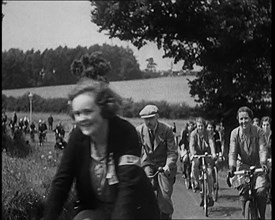 Large Group of Civilians Riding Bicycles Through Country Lanes, 1931. Creator: British Pathe Ltd.