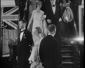 People in Evening Dress Walking Down Stairs, 1931. Creator: British Pathe Ltd.