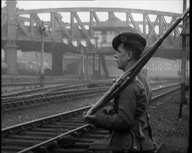 A Male Armed Soldier Guarding Railway Lines, 1926. Creator: British Pathe Ltd.