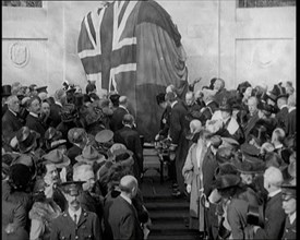 French and British Crowd Watching as a Union Flag and Tricolore Are Removed to Reveal..., 1920. Creator: British Pathe Ltd.