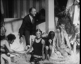 American Politician Franklin Delano Roosevelt Laughing as People Around Him Are Jumping..., 1921. Creator: British Pathe Ltd.