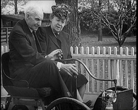 Henry and Clara Ford Sitting in an Old Motorcar, 1921. Creator: British Pathe Ltd.