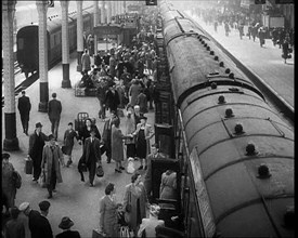 People at  a Train Station, 1933. Creator: British Pathe Ltd.