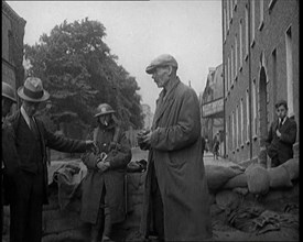 Men Being Stopped and Searched at a Roadblock in Ireland, United Kingdom, 1920. Creator: British Pathe Ltd.