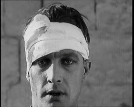 Scene from a Film: Male Actor Playing a Survivor from the Battle Being Questioned..., 1920s. Creator: British Pathe Ltd.