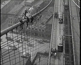 Men Painting the Brooklyn Bridge in New York City, 1922. Creator: British Pathe Ltd.