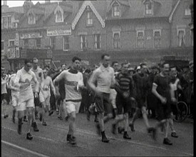 Crowds Watching a Men's Walking Race in the Street, 1920. Creator: British Pathe Ltd.