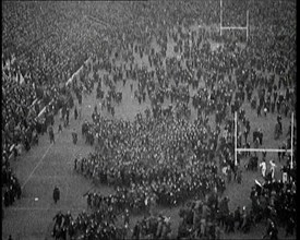 People Crowding the Pitch After an American Football Game, 1922. Creator: British Pathe Ltd.