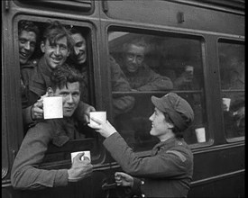 British Soldiers Receiving Food and Drink on the Train Back To Camp, 1940. Creator: British Pathe Ltd.