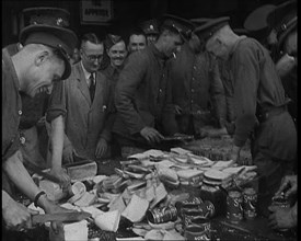 British Soldiers Receiving Food and Drinks at Camp, 1940. Creator: British Pathe Ltd.