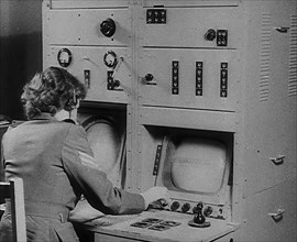 A Woman Operating a Radio, 1940. Creator: British Pathe Ltd.