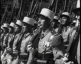 Male French Foreign Legion Soldiers Marching in a Bastille Day Military Parade, 1939. Creator: British Pathe Ltd.