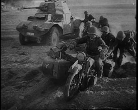 German Soldiers Advancing Through Dusty Fields on Military Vehicles To Cut Off Allied Units..., 1940 Creator: British Pathe Ltd.