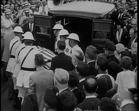 Male American Soldiers in White Uniforms Taking the Coffin of Anton Cermak, the Mayor of..., 1933. Creator: British Pathe Ltd.