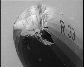 Front View of the 'R.33' Zeppelin With a Dented and Damaged Nose After Flying Through a Storm, 1924. Creator: British Pathe Ltd.