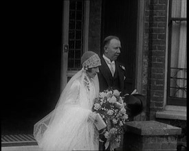 John Henry Thomas and His Daughter Emerging from a Building, 1924. Creator: British Pathe Ltd.