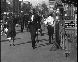 Smartly Dressed People Walking Along the Streets of New York City, 1932. Creator: British Pathe Ltd.