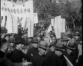 A Chinese Anti-War Protest With Male Attendees Both Military and Civilian Present Some..., 1938. Creator: British Pathe Ltd.