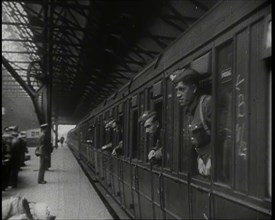 Male Members of the British Expeditionary Force Leaning Out of the Carriages as a Train is..., 1939. Creator: British Pathe Ltd.