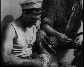 British Soldier Counting Bullets on Board a Ship Evacuating Him from Dunkirk, 1940. Creator: British Pathe Ltd.