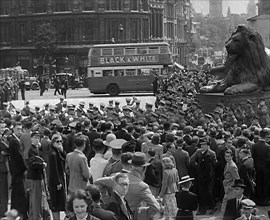 Crowds Watching a Military Band March in Trafalgar Square, 1940. Creator: British Pathe Ltd.