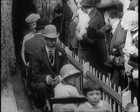 King George V and Queen Mary of the United Kingdom Sit in a Model Train As It Passes..., 1924. Creator: British Pathe Ltd.